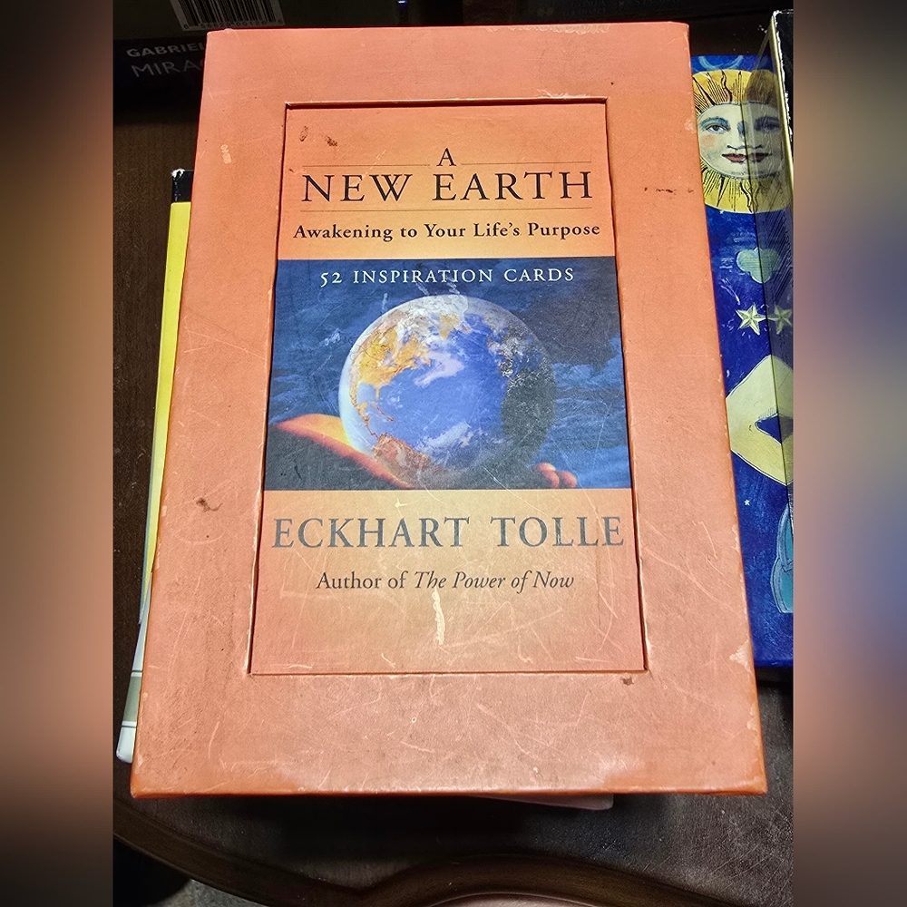 A New Earth Inspiration Deck" by Eckhart Tolle, which contains 52 inspiration